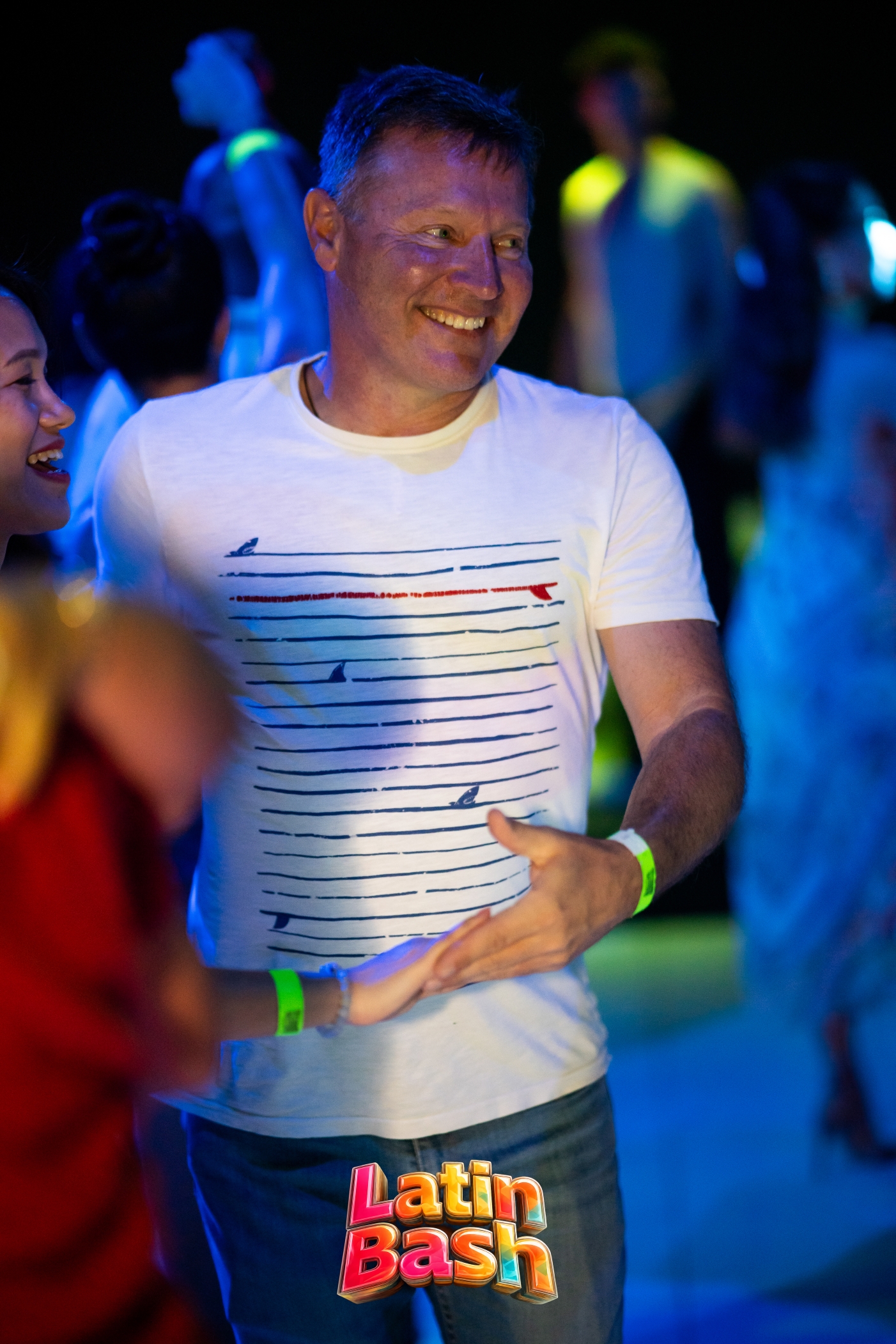 Smiling while dancing at Latin Bash