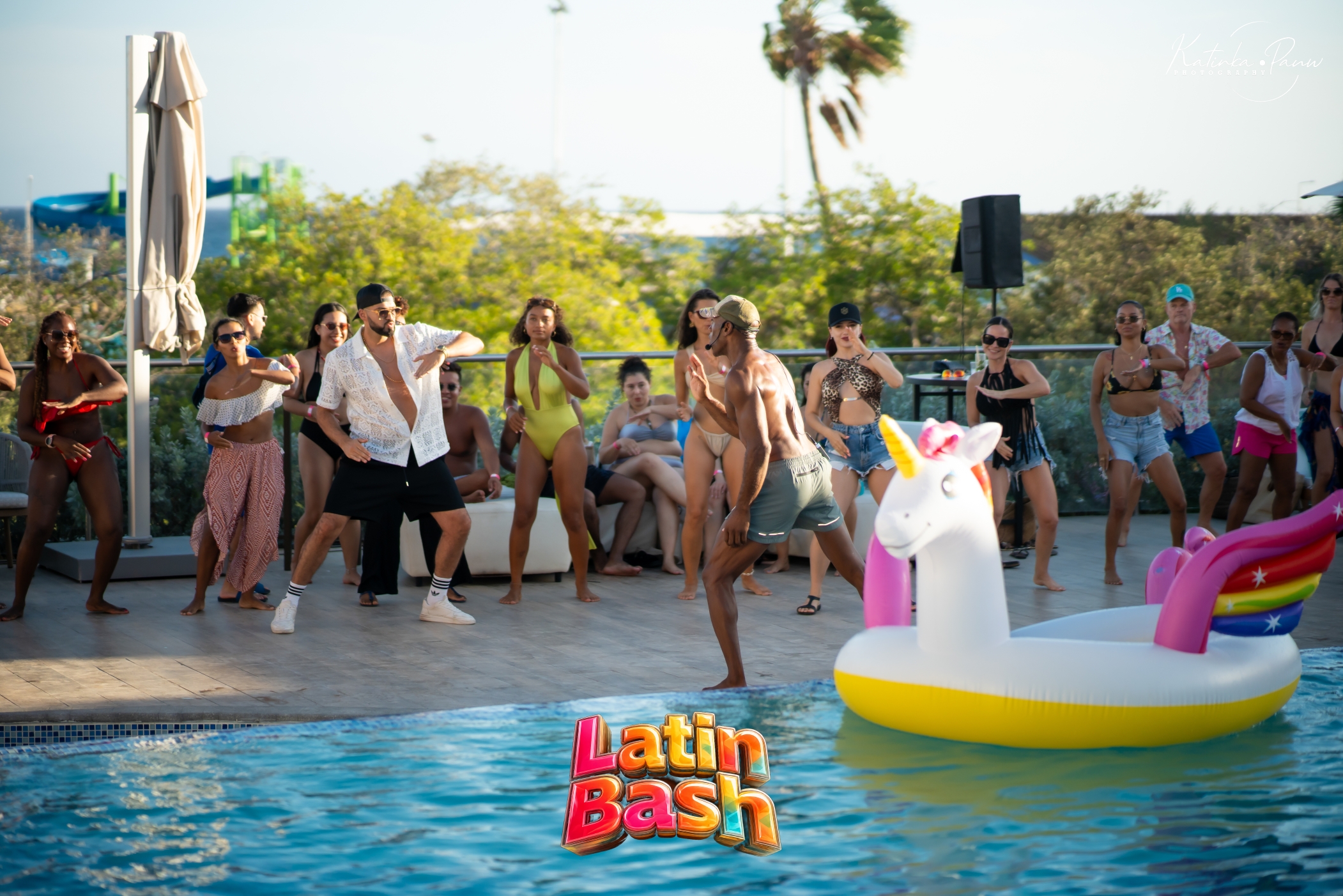 Group dancing beside the pool