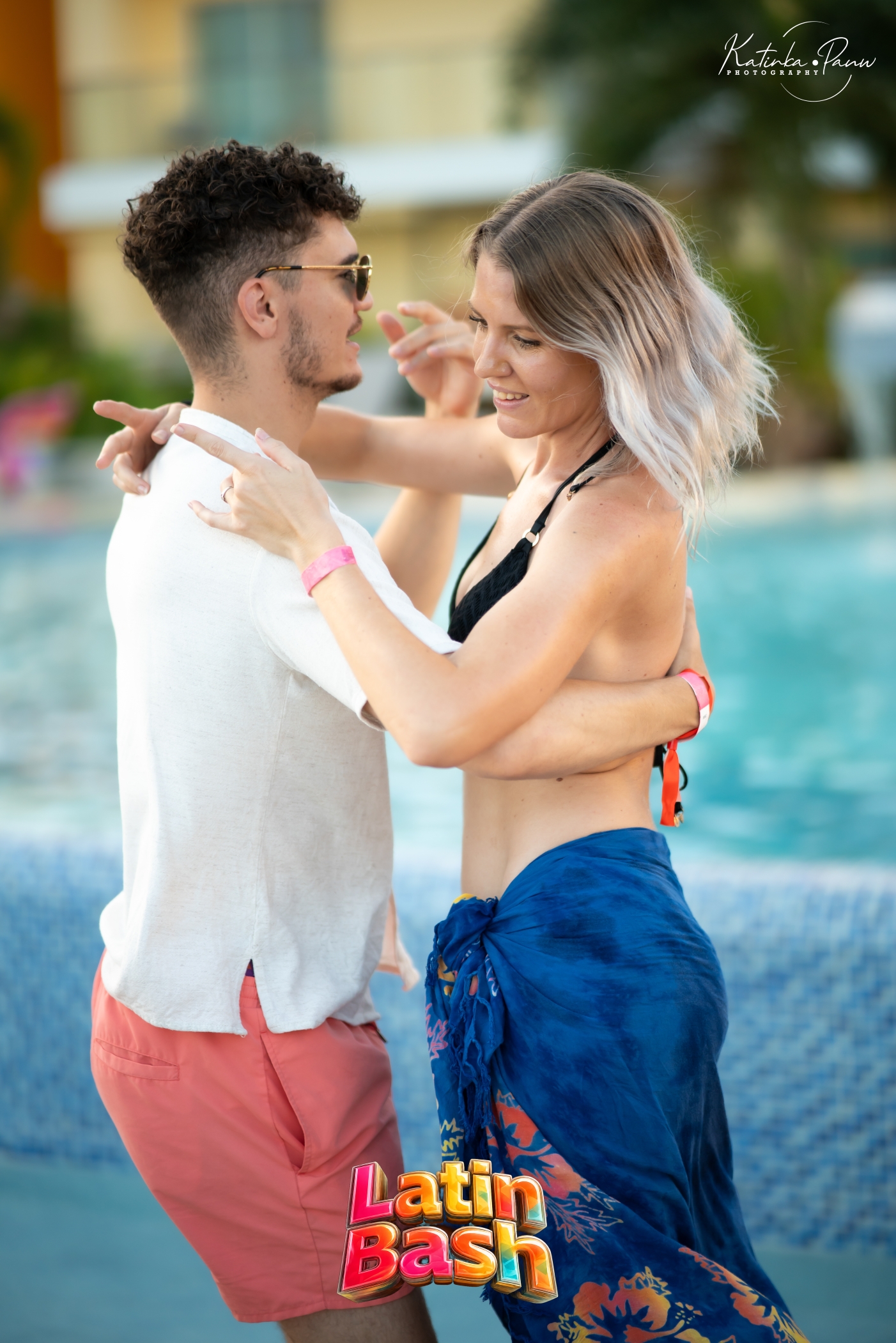 Dance couple beside the pool